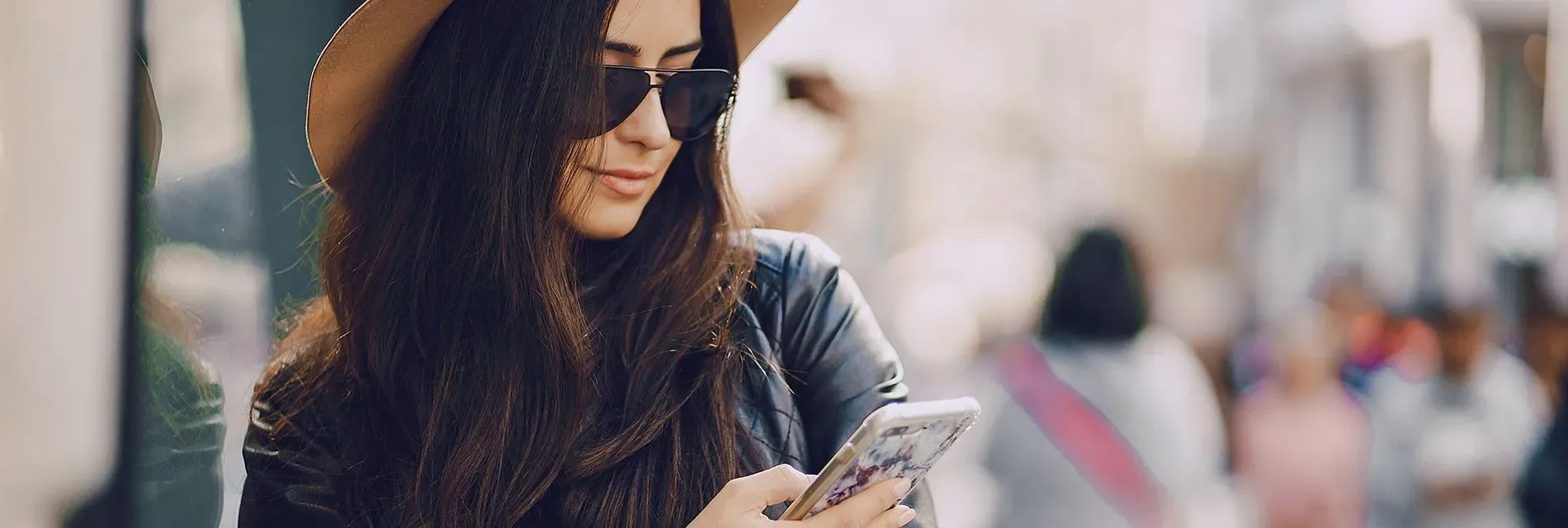 A woman on a Phone making a minicab booking